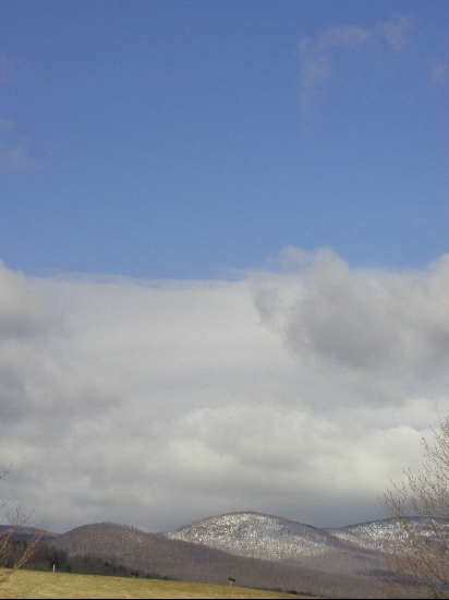 Early spring, the last of the snow is still in the hills.